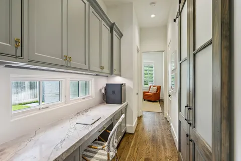 a hallway with a stove and a window