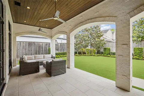 a living room with couch and a garden