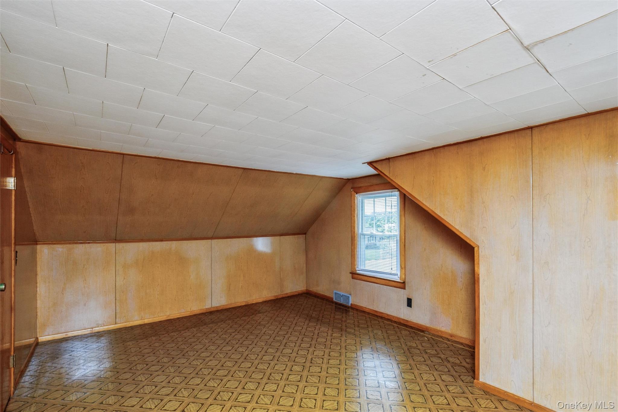 10 Laurel Road Ronkonkoma, NY 11779 - Photo 12 of 21 a view of a big room with wooden floor and windows