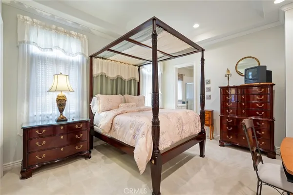 a bed room with a bed and a dresser