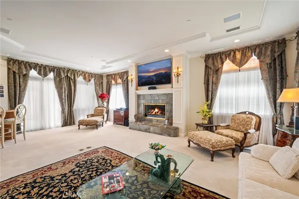 a bedroom with a bed and a television