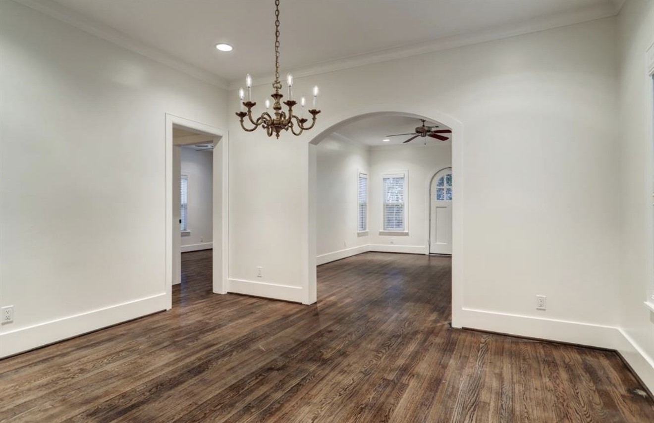 1624 Vassar Street Houston, TX 77006 - Photo 7 of 11 a view of a big room with wooden floor and chandelier