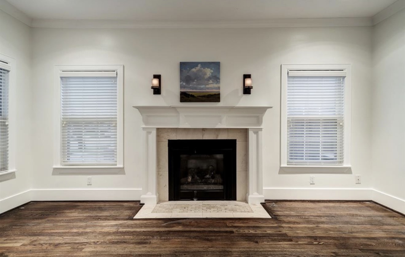 1624 Vassar Street Houston, TX 77006 - Photo 8 of 11 a living room with a fireplace and a fireplace