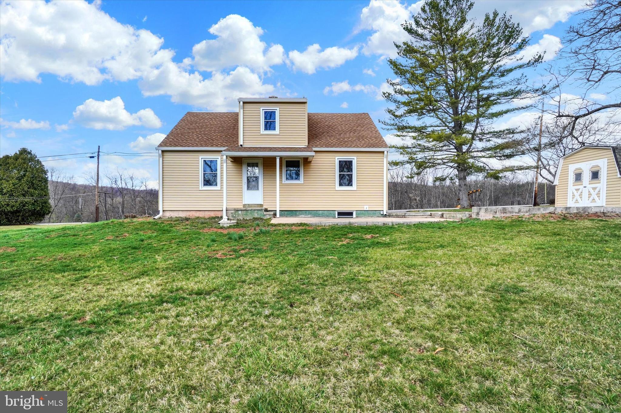 1050 Buck Road Dover, PA 17315 - Photo 20 of 28 a front view of a house with a yard
