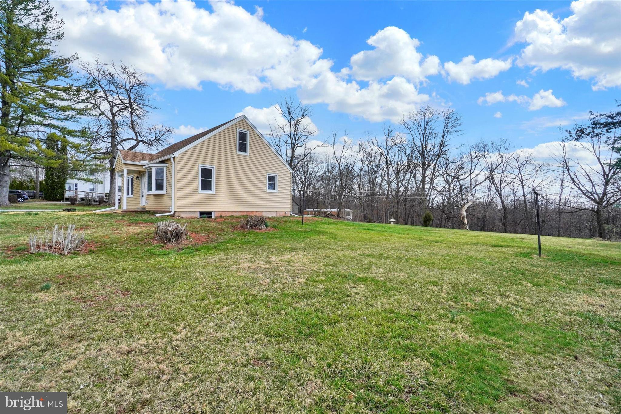 1050 Buck Road Dover, PA 17315 - Photo 22 of 28 a view of a house with a yard