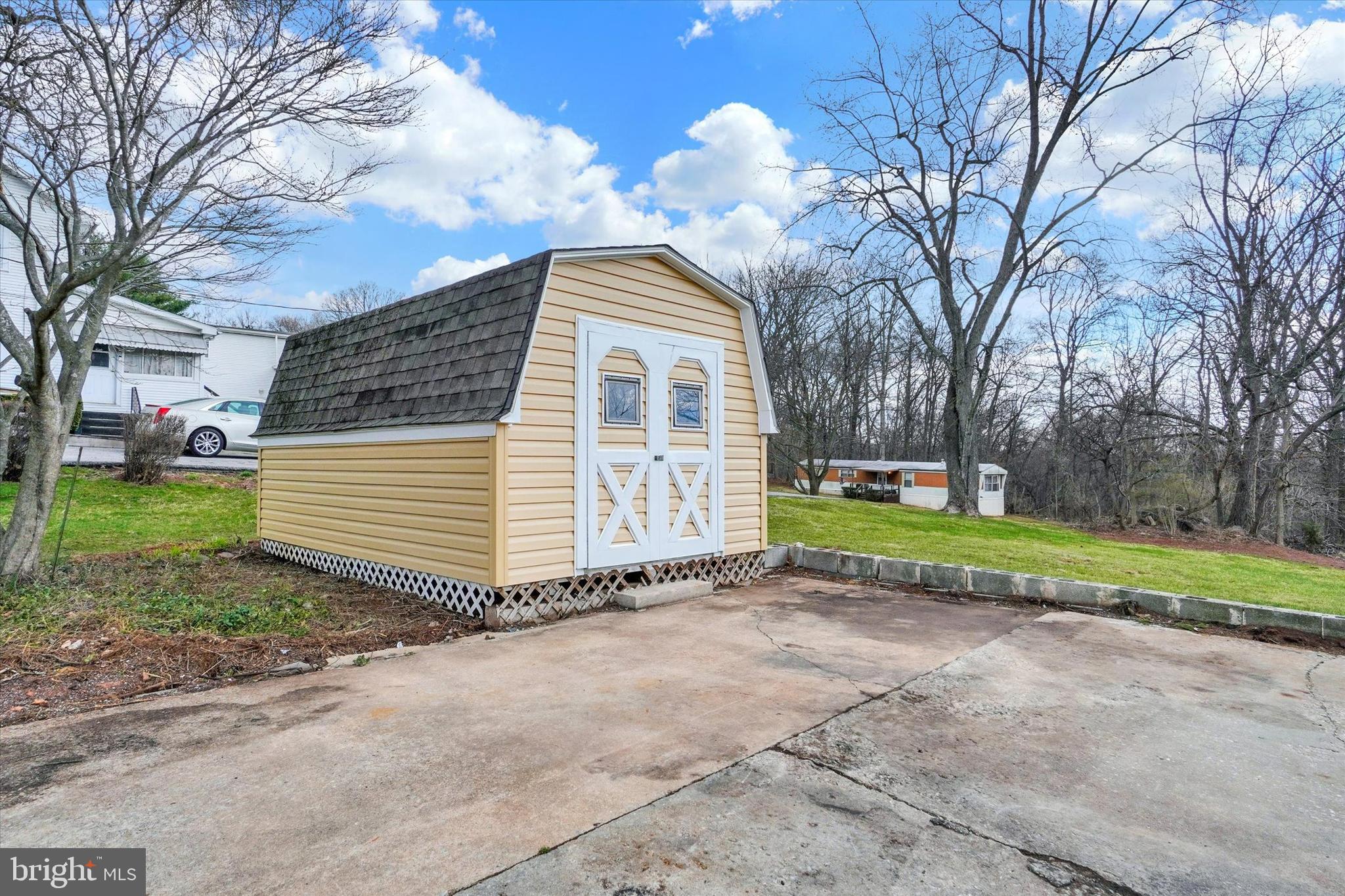1050 Buck Road Dover, PA 17315 - Photo 24 of 28 a view of a house with a yard