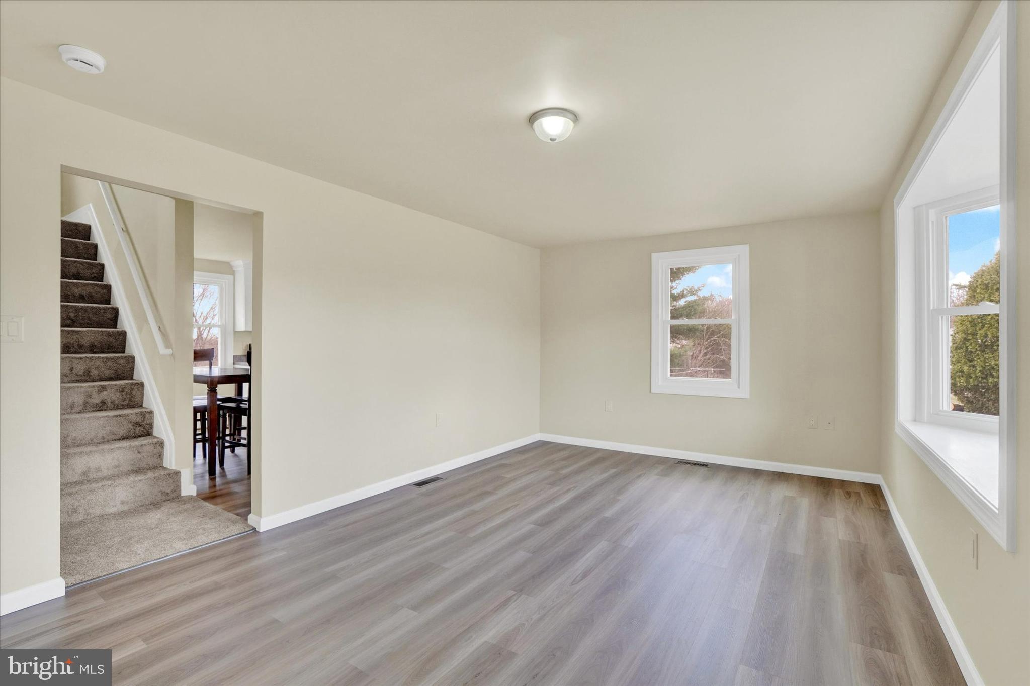 1050 Buck Road Dover, PA 17315 - Photo 5 of 28 wooden floor in an empty room with a window