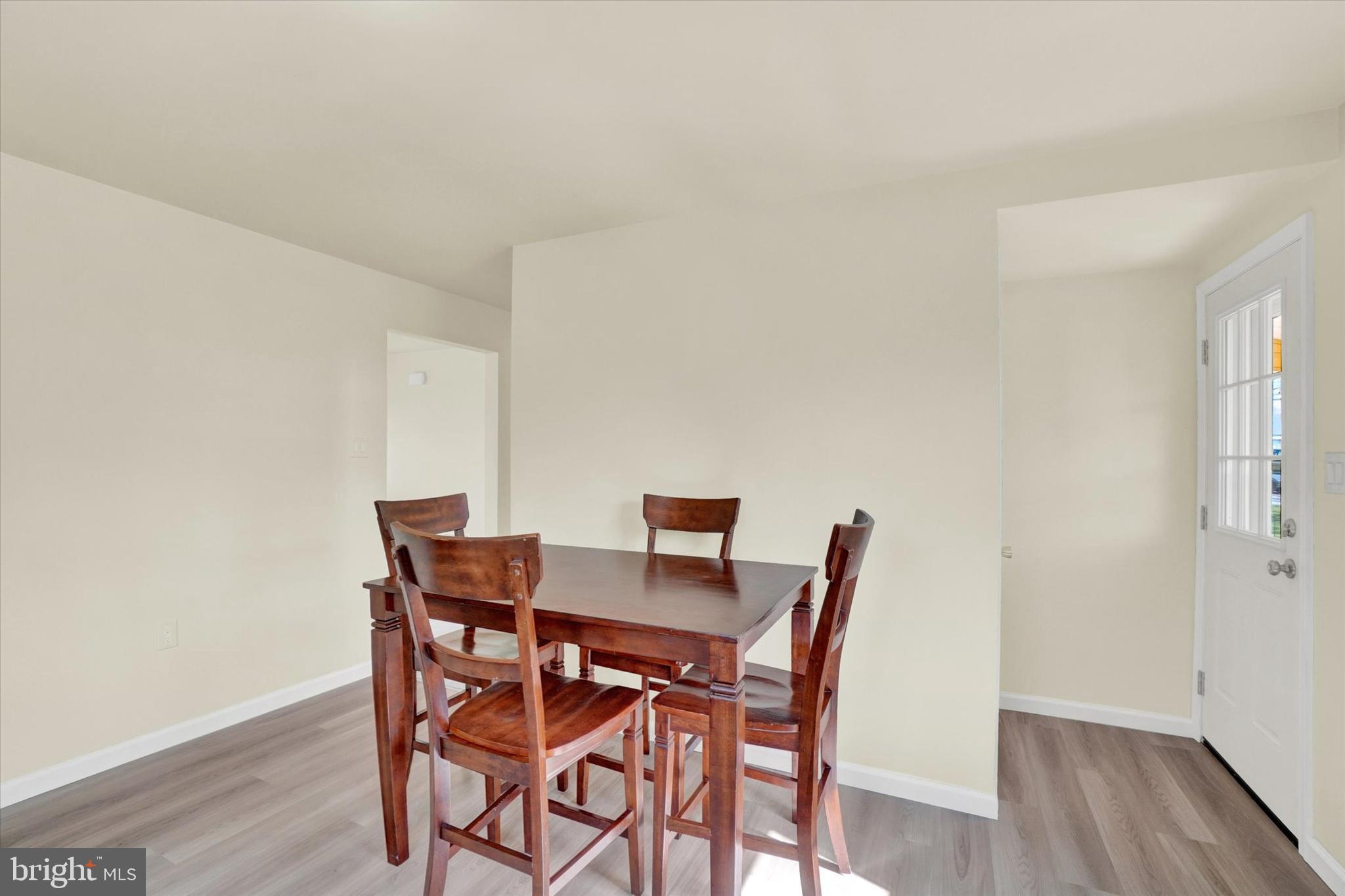 1050 Buck Road Dover, PA 17315 - Photo 8 of 28 a view of a dining room with furniture and wooden floor