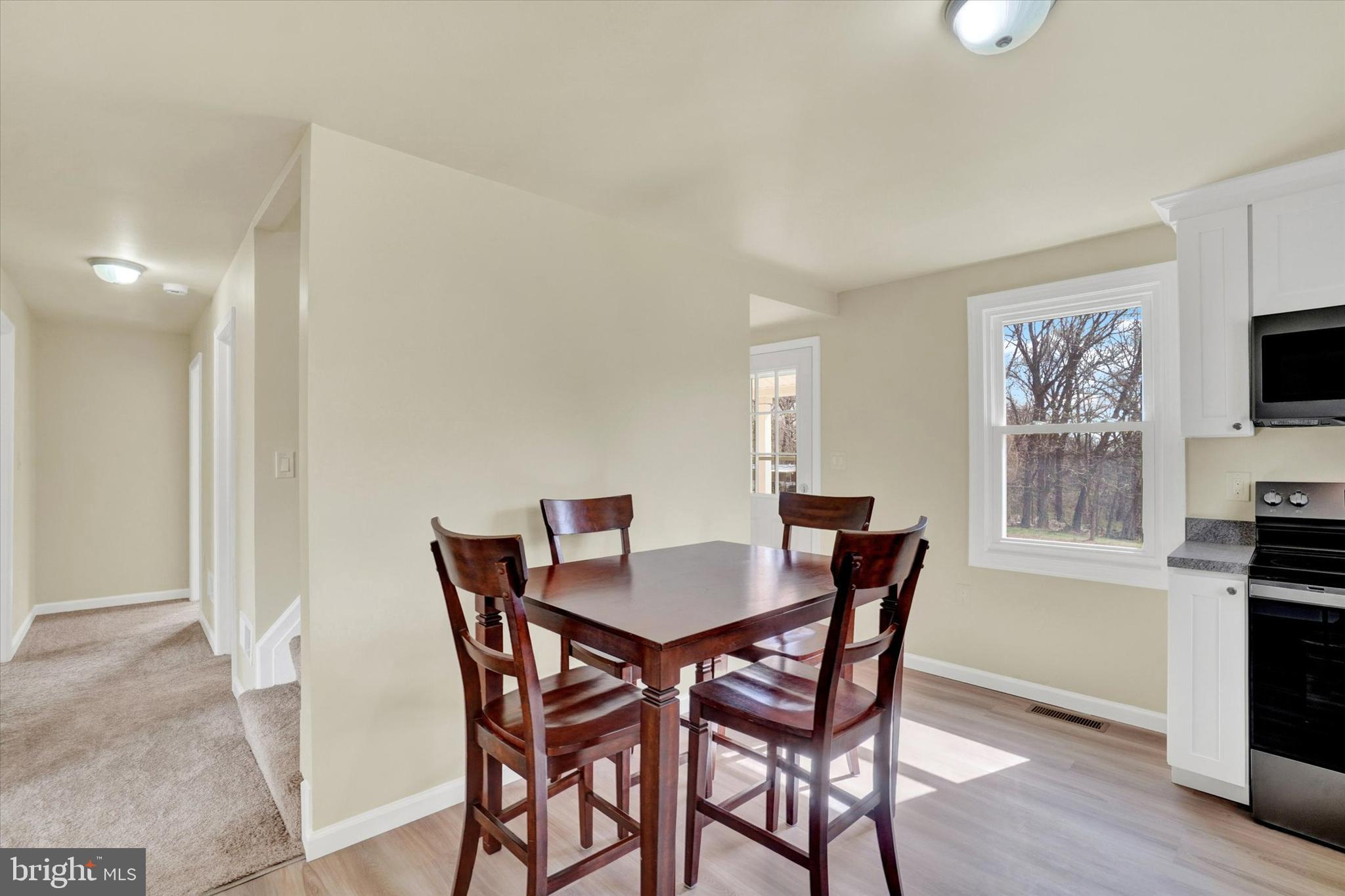 1050 Buck Road Dover, PA 17315 - Photo 9 of 28 a view of a dining room with furniture and wooden floor