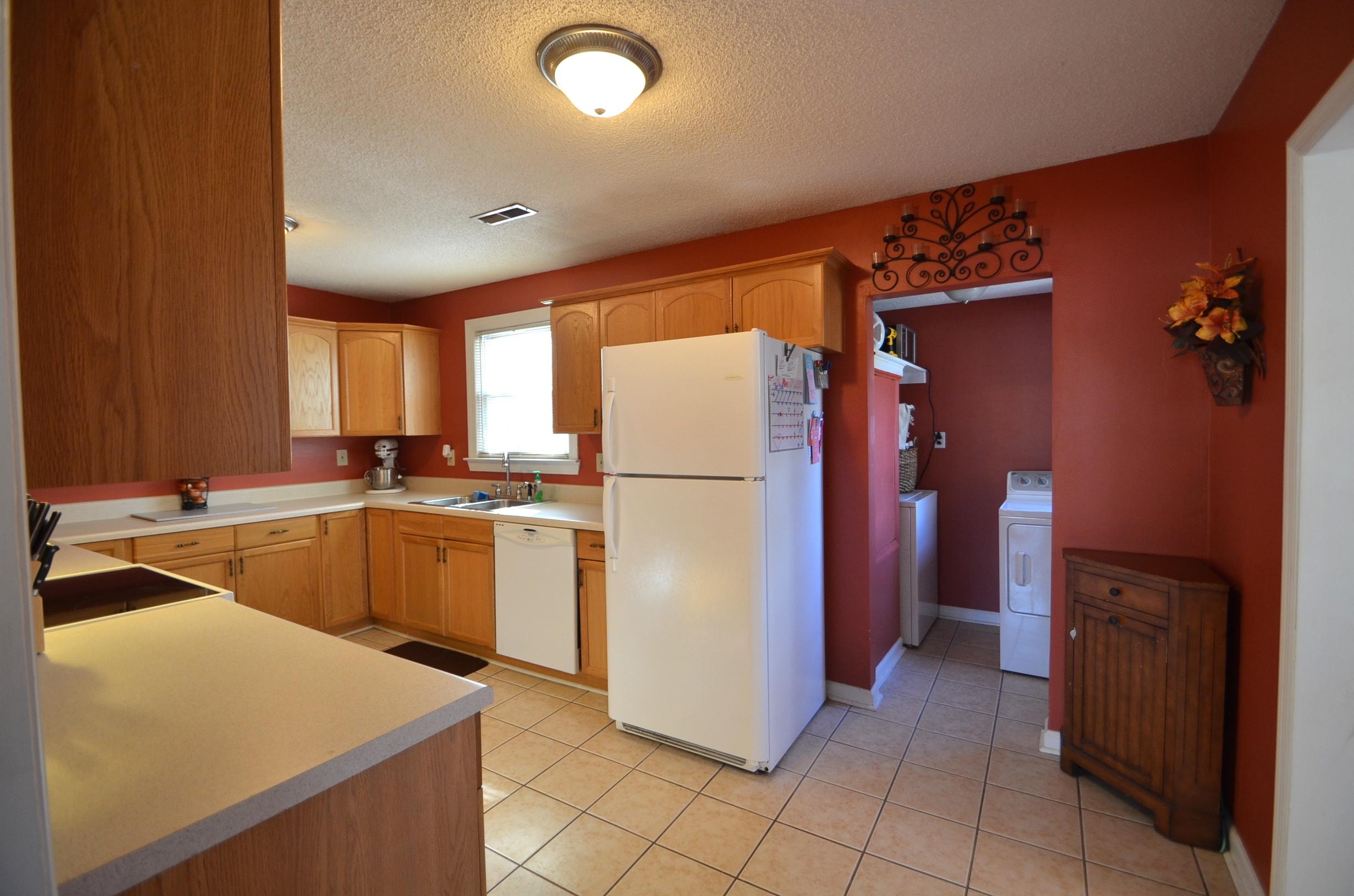 211 Warren Street Moncks Corner, SC 29461 - Photo 4 of 14 Kitchen with laundry room in background