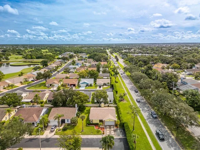 an aerial view of residential houses with outdoor space