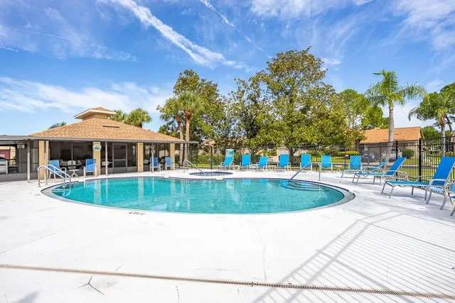 a view of swimming pool with seating space