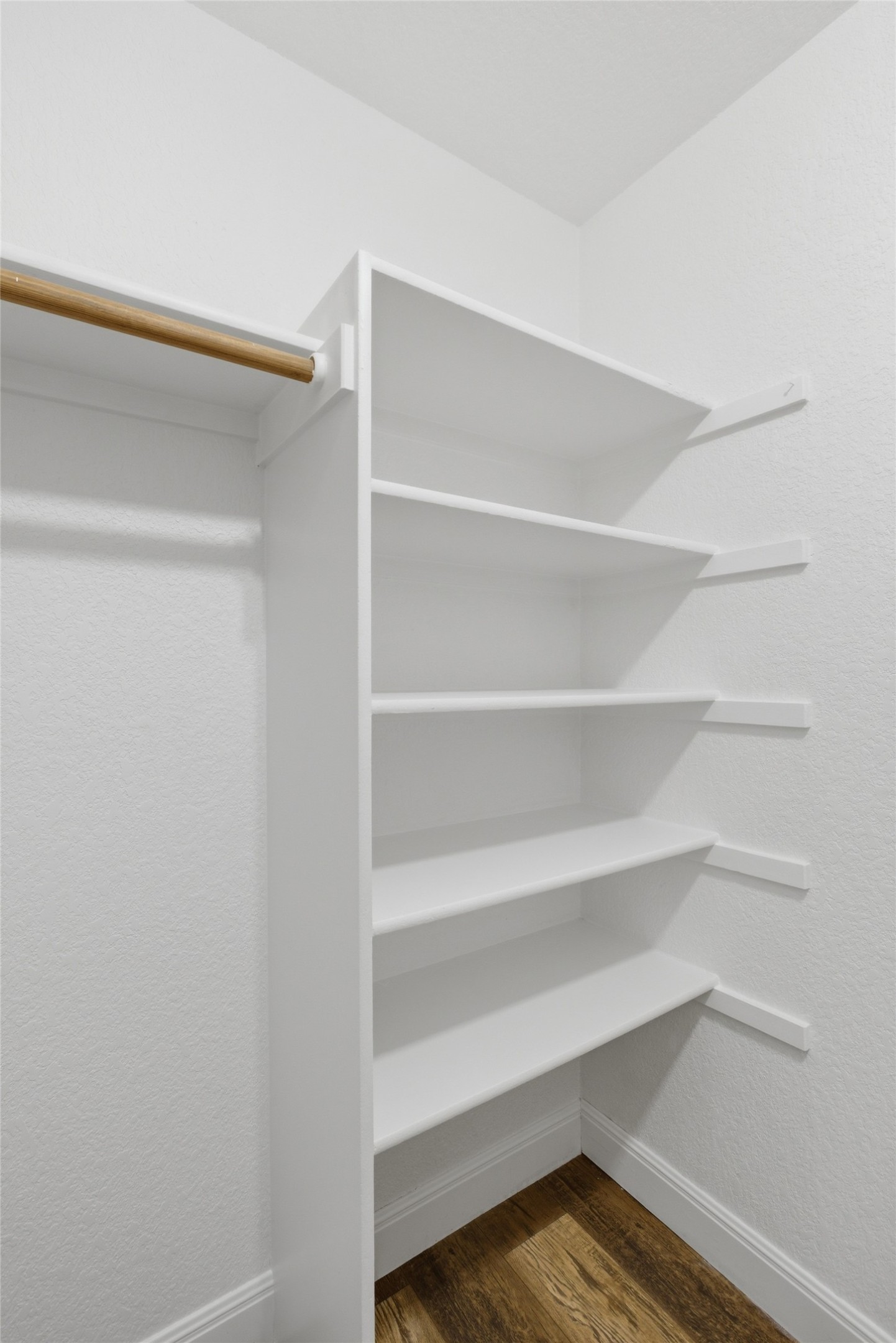 112 Prairie Springs Loop Georgetown, TX 78626 - Photo 16 of 23 a view of walk in closet with empty racks