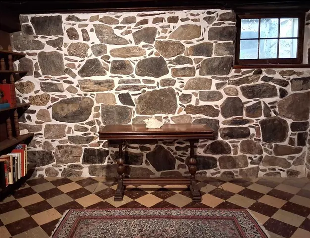 a bathroom with a sink a mirror and a shower