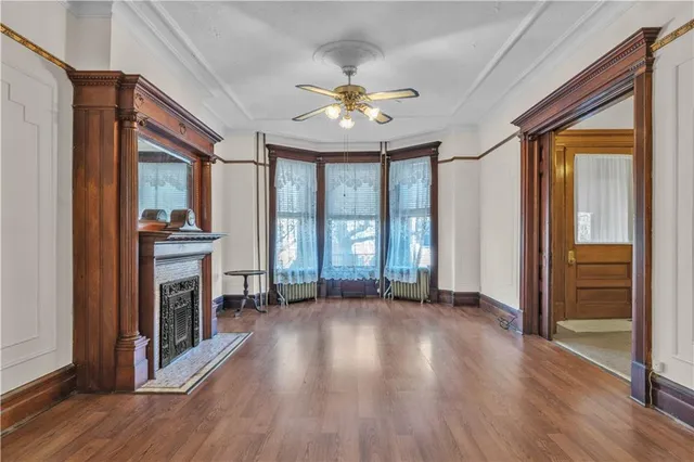 a large bathroom with mirror a sink and a refrigerator