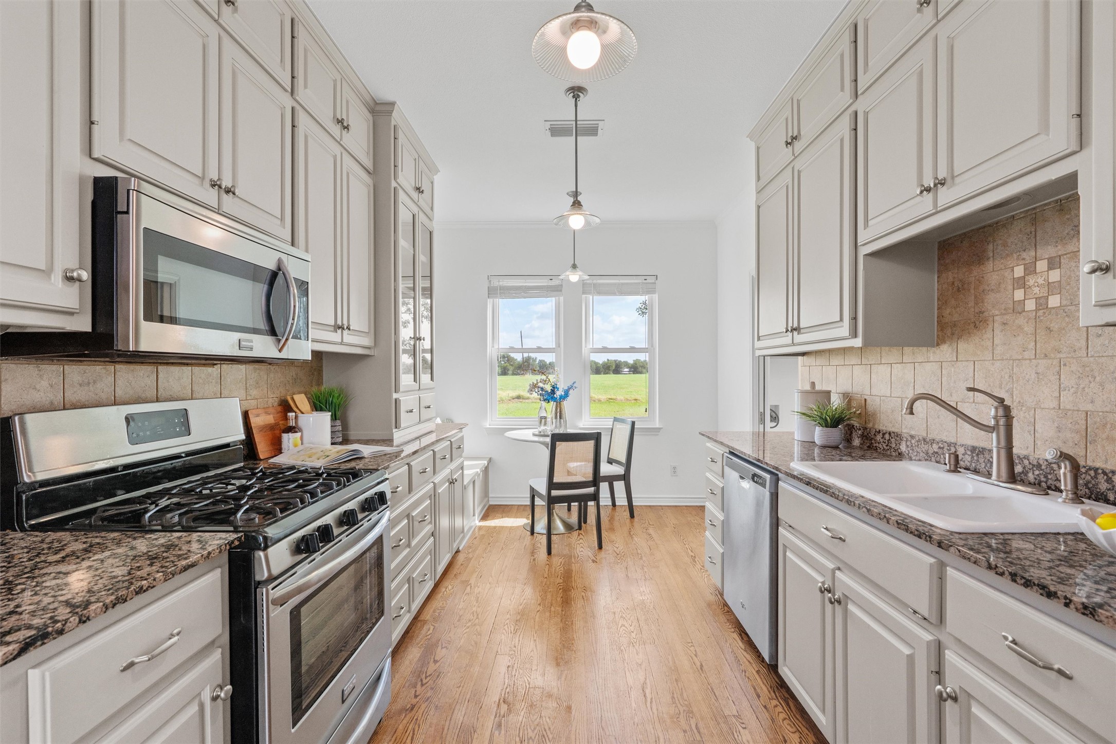768 Upper Elgin River Road Elgin, TX 78621 - Photo 5 of 40 Custom galley kitchen. Tons of cabinets.