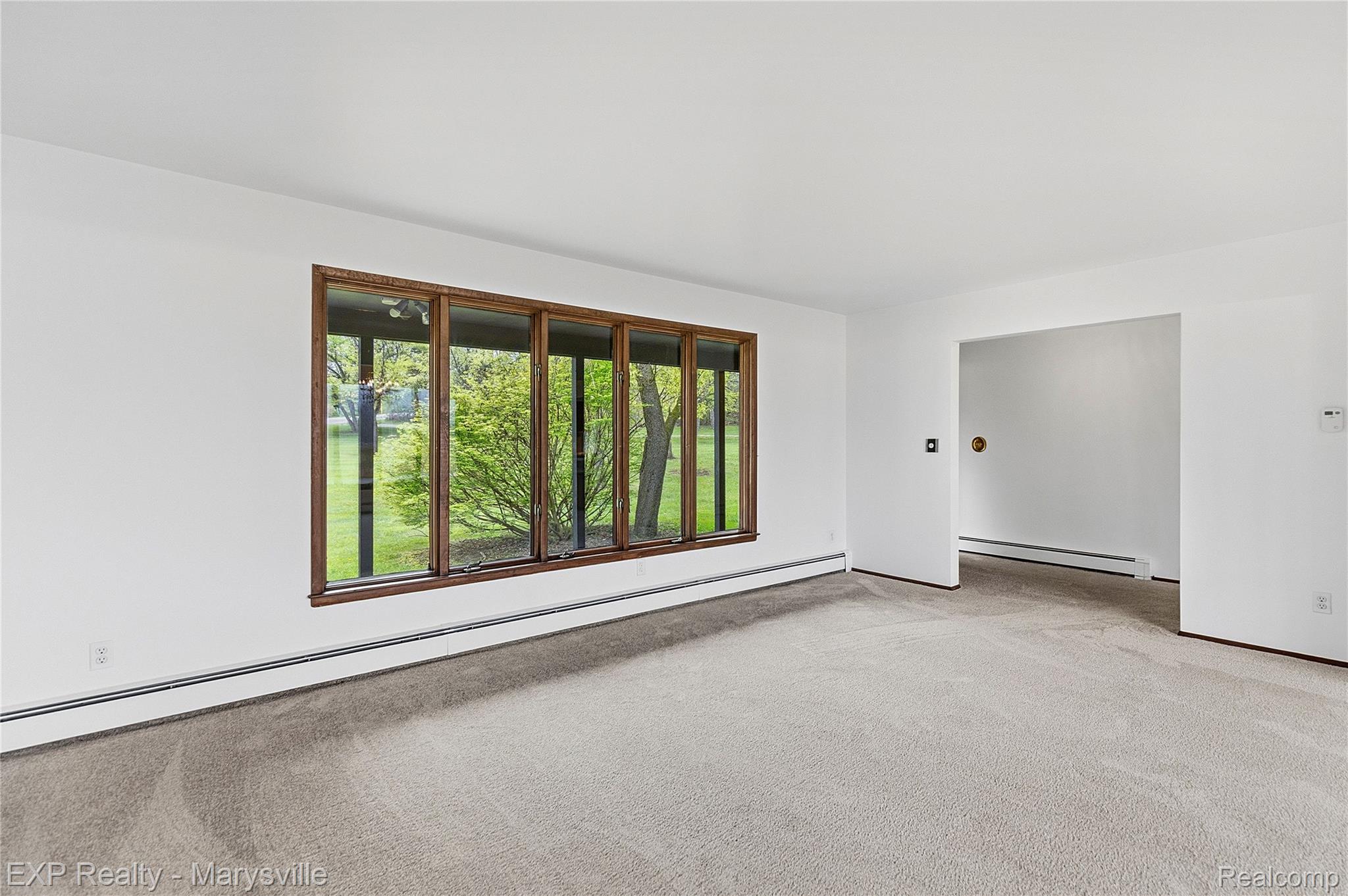 3345 Beach Road Port Huron, MI 48060 - Photo 29 of 89 Unfurnished room with baseboard heating and light colored carpet