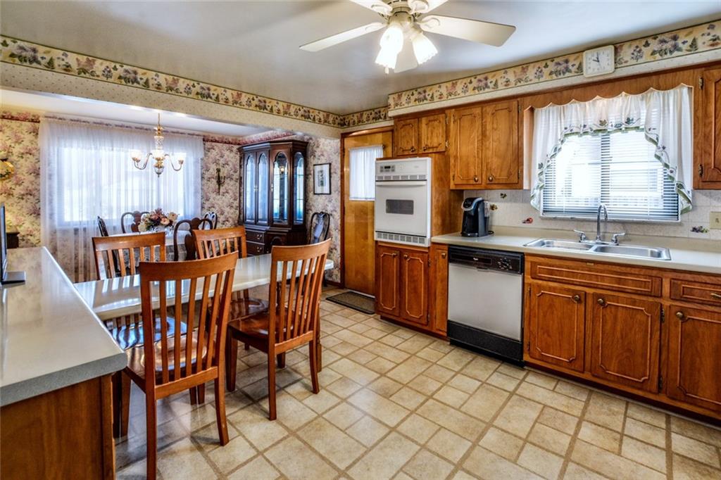 1289 Low Grade Road Harwick, PA 15049 - Photo 5 of 19 The open kitchen with new appliances has outdoor access through a new door/screen set to the patio/covered porch area and flat fenced-in yard.