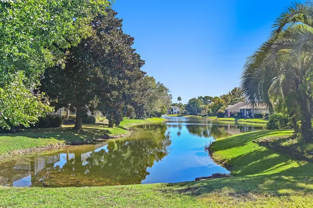 a view of a lake with a house in the background