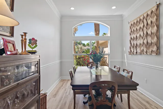 a view of a dining room with furniture window and wooden floor