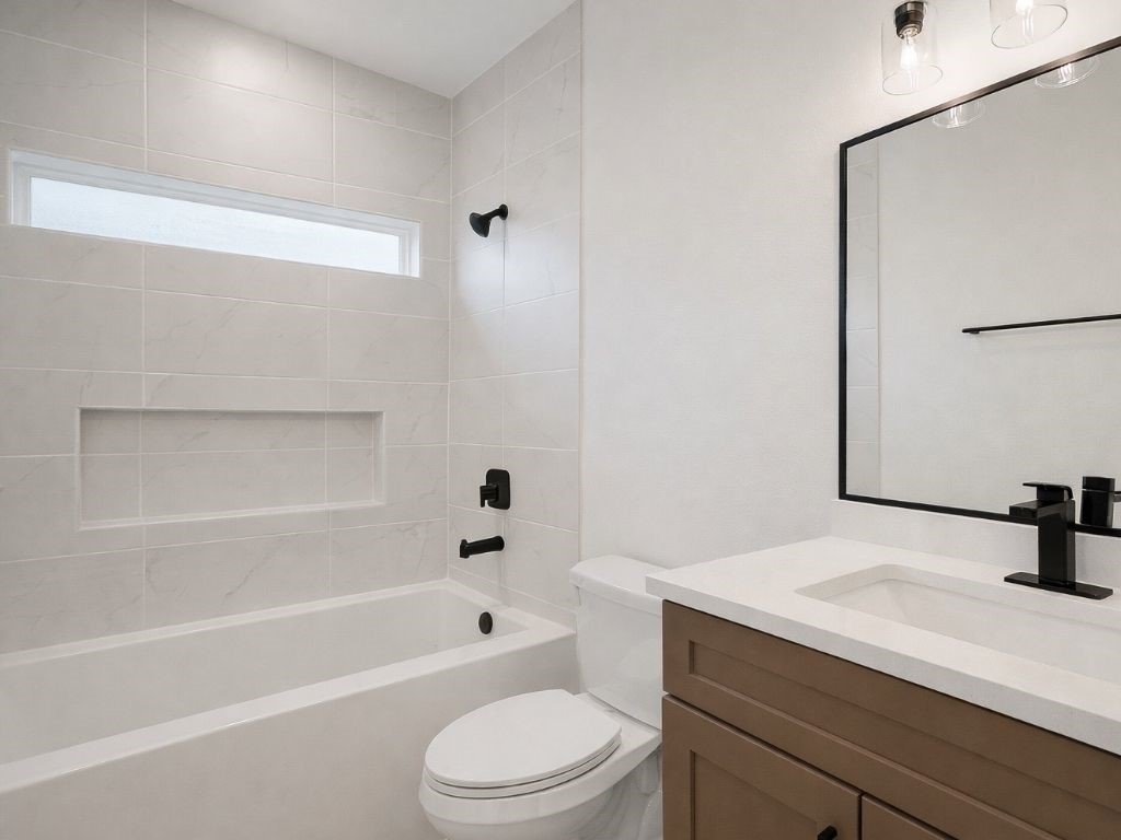 25696 John Wayne Drive Splendora, TX 77372 - Photo 6 of 6 a bathroom with a sink a toilet and a bathtub