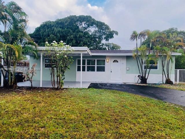 a front view of house with yard and seating area