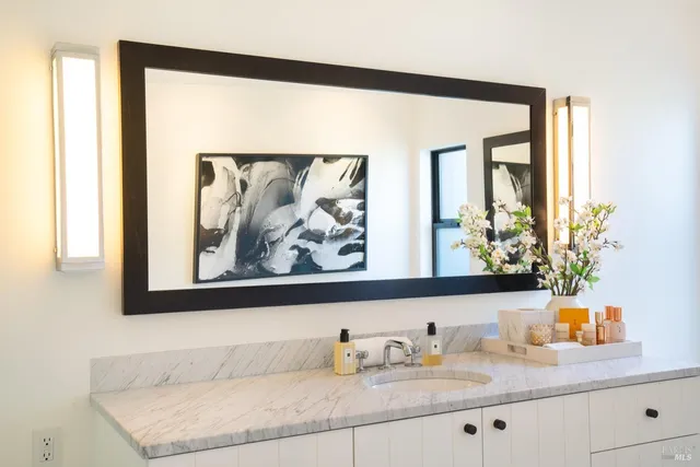 a bathroom with a sink and a mirror