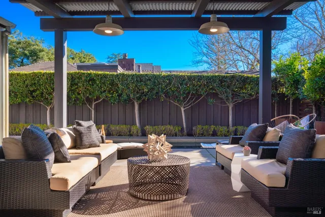 a patio with patio a couch and chairs