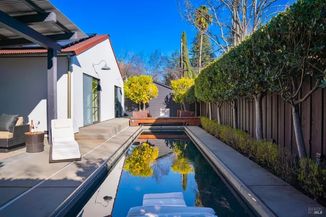 a view of swimming pool with seating area
