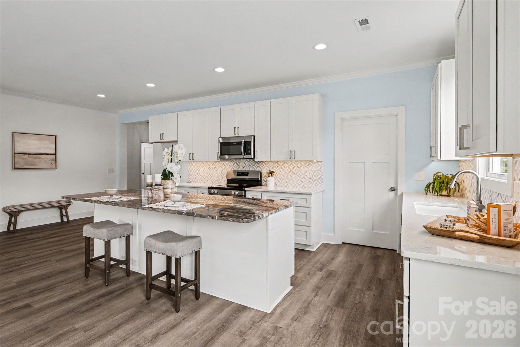 4115 Miller Road Salisbury, NC 28147 - Photo 8 of 26 a kitchen with a sink cabinets and wooden floor
