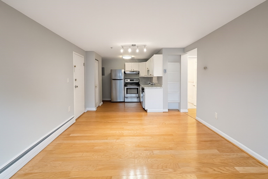 a view of a kitchen with a sink and cabinets