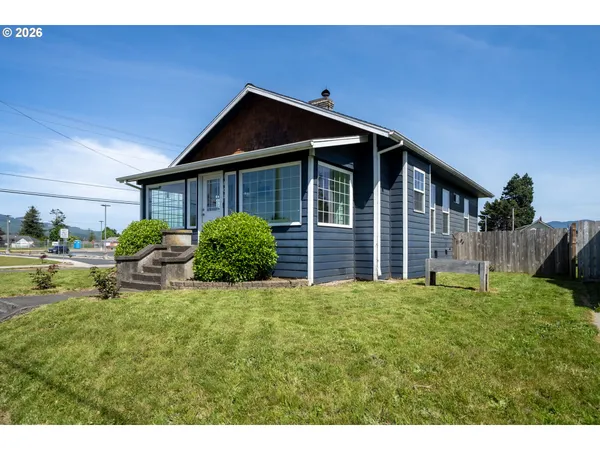 a view of front of house with a yard