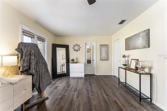 a kitchen with stainless steel appliances sink a refrigerator and wooden cabinets
