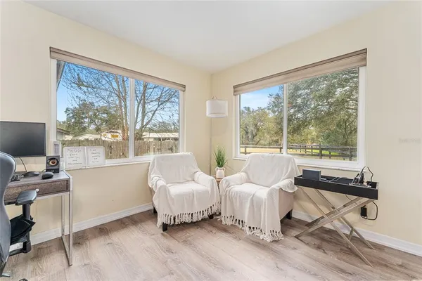 an aerial view of a house with swimming pool garden and patio