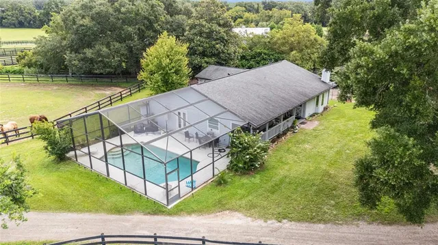 a kitchen with kitchen island a sink appliances and a counter top space