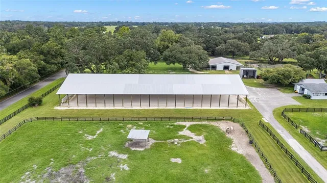 a view of swimming pool with a chairs