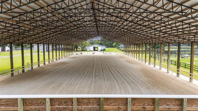 a front view of a house with yard and green space