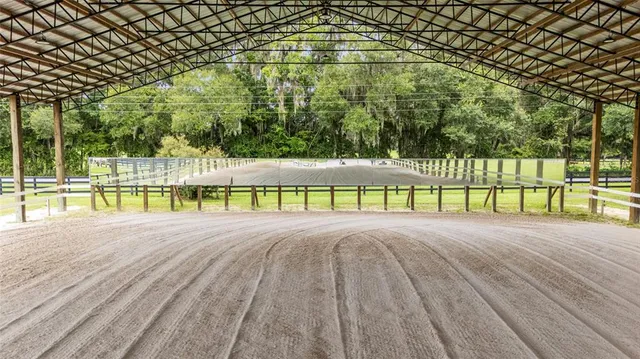 a view of a garden with an outdoor seating