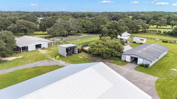 a view of a swimming pool with an outdoor seating and yard