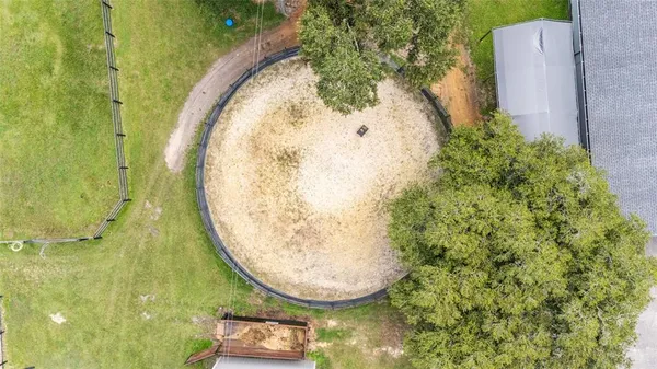 a front view of a house with yard and green space