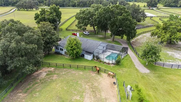 a view of a garden with an outdoor seating
