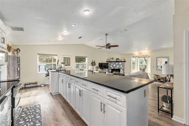 a bathroom with a double vanity sink mirror and shower