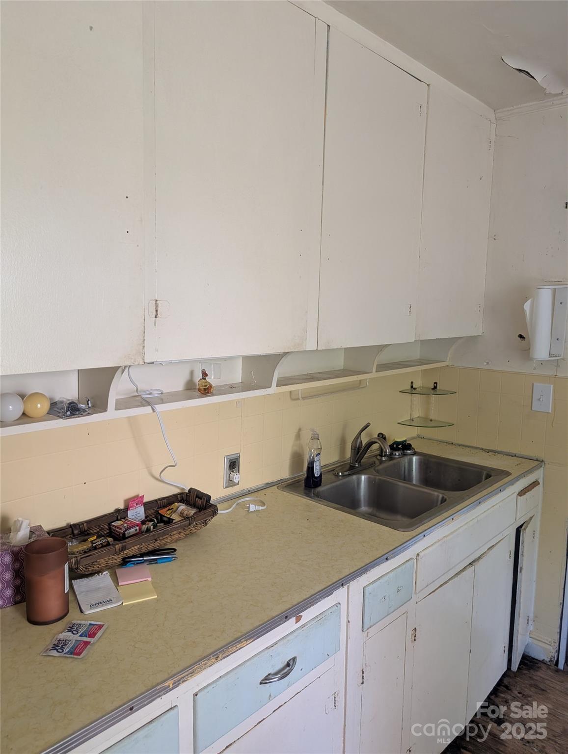 720 New Market Road Tryon, NC 28782 - Photo 4 of 15 a kitchen with a sink and cabinets