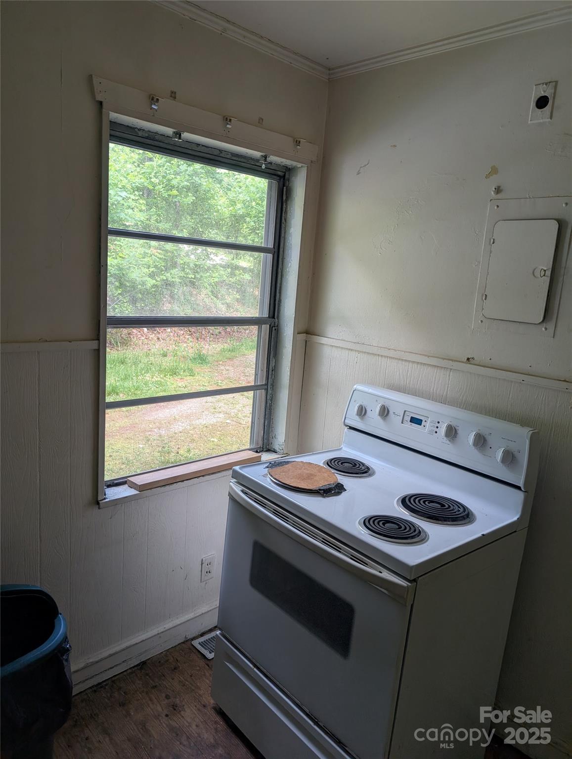 720 New Market Road Tryon, NC 28782 - Photo 5 of 15 a kitchen with a stove and a window