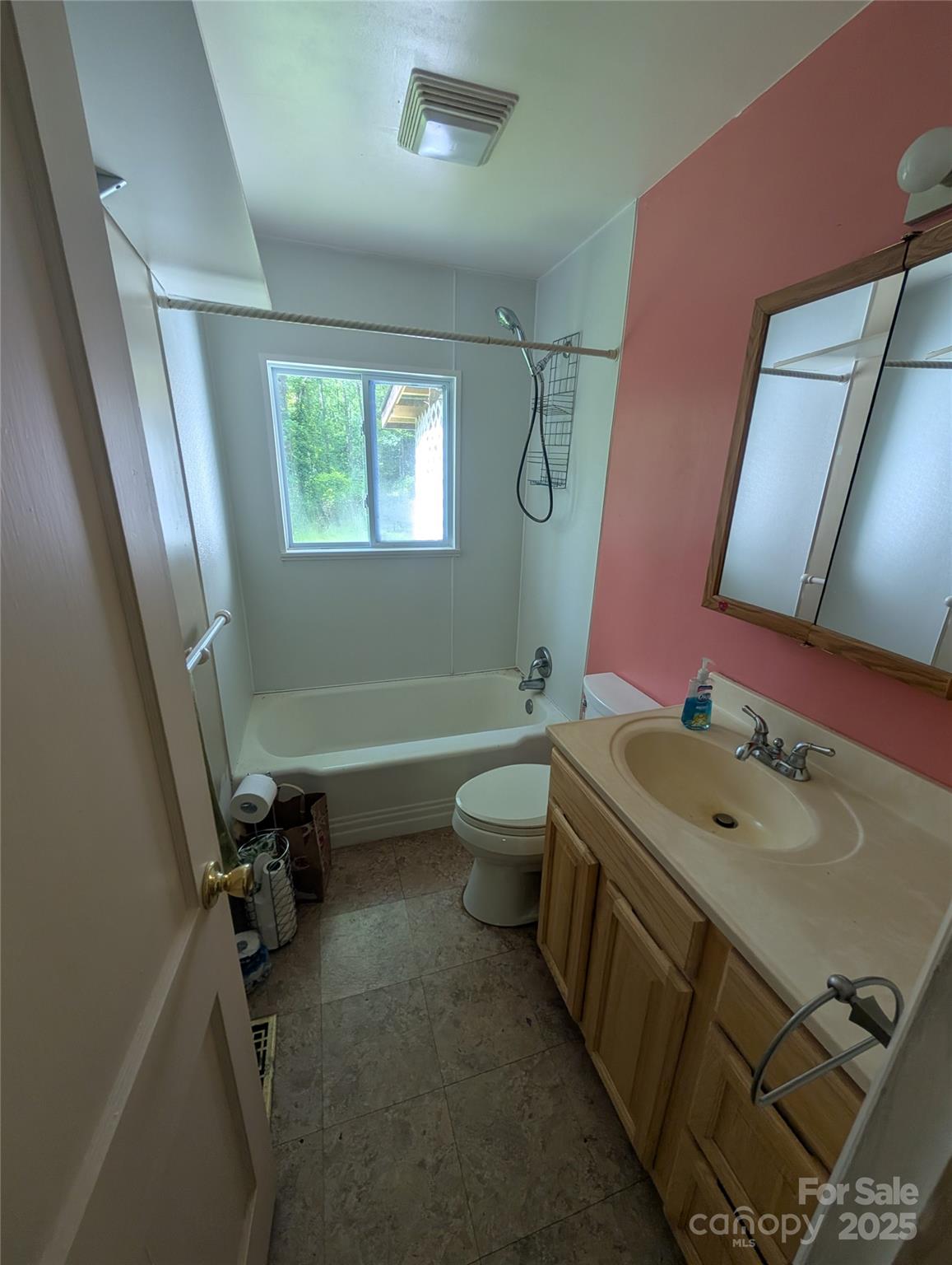 720 New Market Road Tryon, NC 28782 - Photo 7 of 15 a bathroom with a sink toilet and tub