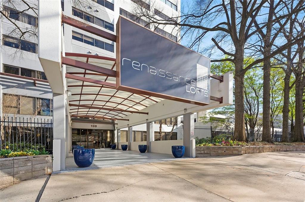 a view of a building with a tree
