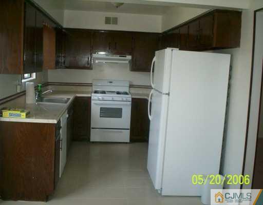 436 Middlewood Road Middletown, NJ 07748 - Photo 3 of 4 a kitchen with a refrigerator sink and stove