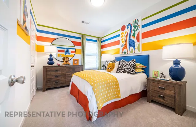 a bedroom with a bed and dresser