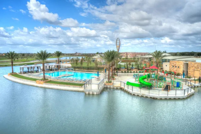 a view of a swimming pool with an outdoor seating space