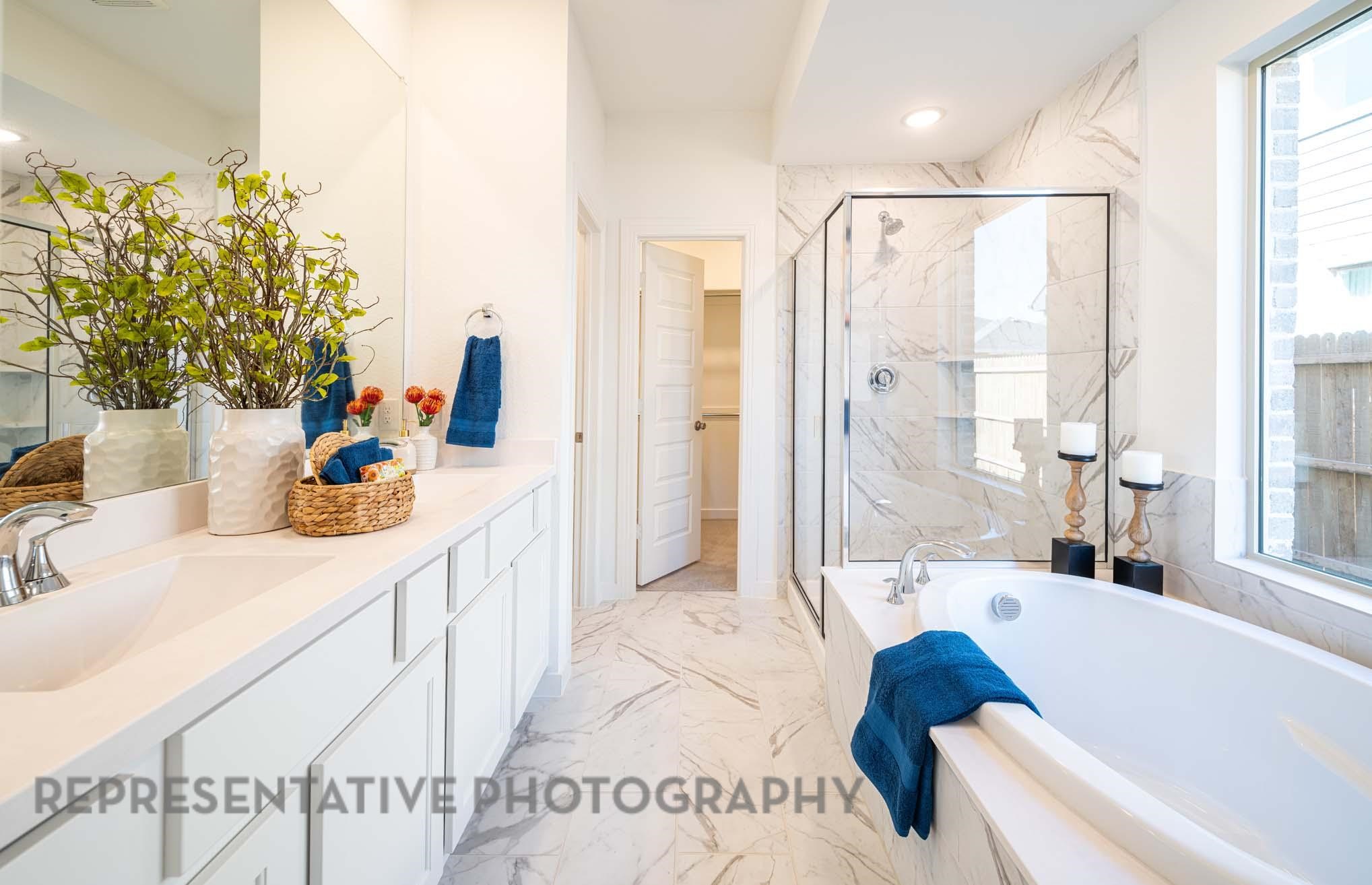 10326 Da Silva Street Manvel, TX 77578 - Photo 8 of 18 a bathroom with a tub sink and mirror